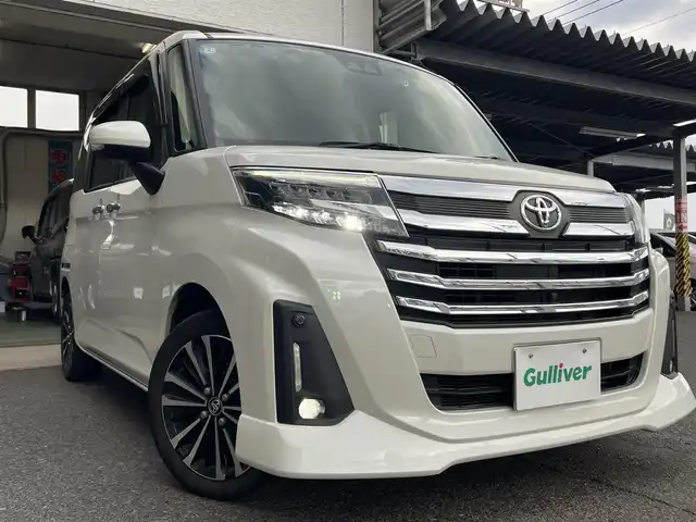 トヨタ ルーミー カスタムG－T 鹿児島県 2022(令4)年 5.5万km パールホワイトⅢ ワンオーナー/純正メモリナビ「NSZT-W68T」/　・DVD・SD・Bluetooth・フルセグTV/パノラミックビューモニター/ビルトインETC/社外前後ドラレコ「コムテック DC-DR652」/純正置くだけ充電/両側パワースライドドア（ウェルカムスイッチあり）/スマートアシスト/　・衝突回避支援ブレーキ/　・車線逸脱警報/　・アダプティブドライビングビーム/　・アダプティブクルーズコントロール/　・コーナーセンサー/純正LEDヘッドライト/純正LEDフォグランプ/オートライト/革巻きステアリング/ステアリングスイッチ/コンフォートパッケージ/　・前席シートヒーター/　・シートバックテーブル/リアサンシェード/純正15インチアルミホイール/電動オート格納ウインカー付ドアミラー/純正フロアマット/純正ドアバイザー/取扱説明書、新車保証書/スペアスマートキーX1本