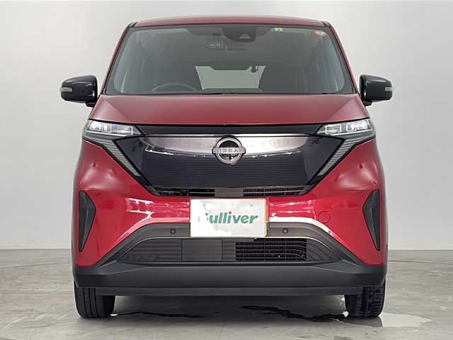 日産 サクラ G 鹿児島県 2023(令5)年 2.4万km スパークリングレッドM スマートキー×2/純正EV専用NissanConnectナビゲーションシステム/アラウンドビューモニター（移動物検知機能付）/前後ドライブレコーダー/プロパイロット/・インテリジェント クルーズコントロール/・ハンドル支援/・VDC（ビークルダイナミクスコントロール/・ABS（アンチロックブレーキシステム）/LEDヘッドライト/LEDポジションランプ（アクセント機能付）/LEDリヤコンビネーションランプ/D席シートヒーター/ステアリングヒーター/充電ケーブル/LEDヘッドライト/コーナーセンサー/純正フロアマット/純正14インチアルミホイール/ビルトインETC2.0