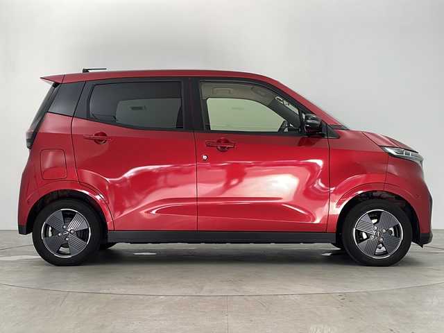 日産 サクラ G 鹿児島県 2023(令5)年 2.4万km スパークリングレッドM スマートキー×2/純正EV専用NissanConnectナビゲーションシステム/アラウンドビューモニター（移動物検知機能付）/前後ドライブレコーダー/プロパイロット/・インテリジェント クルーズコントロール/・ハンドル支援/・VDC（ビークルダイナミクスコントロール/・ABS（アンチロックブレーキシステム）/LEDヘッドライト/LEDポジションランプ（アクセント機能付）/LEDリヤコンビネーションランプ/D席シートヒーター/ステアリングヒーター/充電ケーブル/LEDヘッドライト/コーナーセンサー/純正フロアマット/純正14インチアルミホイール/ビルトインETC2.0