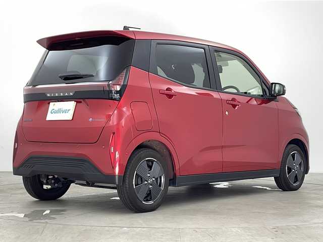 日産 サクラ G 鹿児島県 2023(令5)年 2.4万km スパークリングレッドM スマートキー×2/純正EV専用NissanConnectナビゲーションシステム/アラウンドビューモニター（移動物検知機能付）/前後ドライブレコーダー/プロパイロット/・インテリジェント クルーズコントロール/・ハンドル支援/・VDC（ビークルダイナミクスコントロール/・ABS（アンチロックブレーキシステム）/LEDヘッドライト/LEDポジションランプ（アクセント機能付）/LEDリヤコンビネーションランプ/D席シートヒーター/ステアリングヒーター/充電ケーブル/LEDヘッドライト/コーナーセンサー/純正フロアマット/純正14インチアルミホイール/ビルトインETC2.0