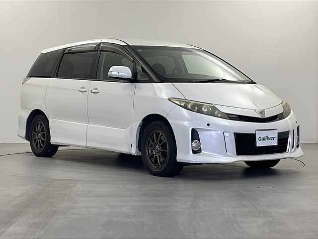 トヨタ エスティマ アエラス 栃木県 2012(平24)年 15.5万km ホワイトパールクリスタルシャイン 純正７インチナビ/（CD/DVD/FM/AM/BT)/バックカメラ/クルーズコントロール/両側パワースライドドア/ドアバイザー/電動格納ミラー/ウインカーミラー/ステアリングリモコン/革巻きステアリング/オットマン/オートエアコン/プッシュスタート/スマートキー/社外１６インチAW