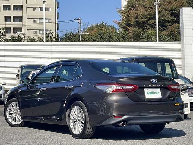 トヨタ カムリ G レザーパッケージ 東京都 2018(平30)年 7万km グラファイトM 純正SDナビ/（フルセグ/BT/CD/DVD/FM/AM）/ドライブレコーダー（前後）/バックカメラ　ETC2.0/ヘッドアップディスプレイ/Toyota Safety Sense P/・LDA・PCS・BSM/・オートマチックハイビーム/・レーダークルーズコントロール/レザーシート/シートヒーター（D/N）/パワーシート（D/N）/オートホールド/コーナーセンサー/スマートキー×２/純正１８インチアルミ/社外AW付スタッドレスタイヤ積載