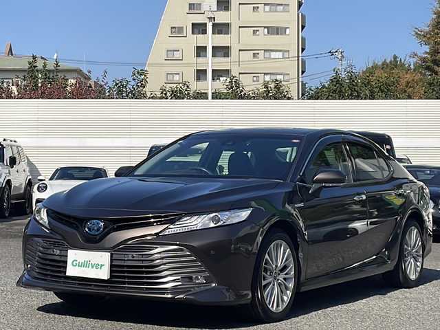 トヨタ カムリ G レザーパッケージ 東京都 2018(平30)年 7万km グラファイトM 純正SDナビ/（フルセグ/BT/CD/DVD/FM/AM）/ドライブレコーダー（前後）/バックカメラ　ETC2.0/ヘッドアップディスプレイ/Toyota Safety Sense P/・LDA・PCS・BSM/・オートマチックハイビーム/・レーダークルーズコントロール/レザーシート/シートヒーター（D/N）/パワーシート（D/N）/オートホールド/コーナーセンサー/スマートキー×２/純正１８インチアルミ/社外AW付スタッドレスタイヤ積載