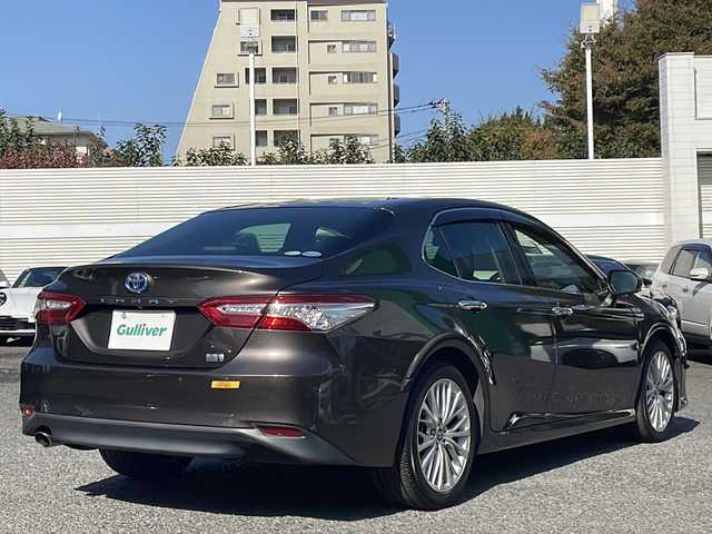 トヨタ カムリ G レザーパッケージ 東京都 2018(平30)年 7万km グラファイトM 純正SDナビ/（フルセグ/BT/CD/DVD/FM/AM）/ドライブレコーダー（前後）/バックカメラ　ETC2.0/ヘッドアップディスプレイ/Toyota Safety Sense P/・LDA・PCS・BSM/・オートマチックハイビーム/・レーダークルーズコントロール/レザーシート/シートヒーター（D/N）/パワーシート（D/N）/オートホールド/コーナーセンサー/スマートキー×２/純正１８インチアルミ/社外AW付スタッドレスタイヤ積載