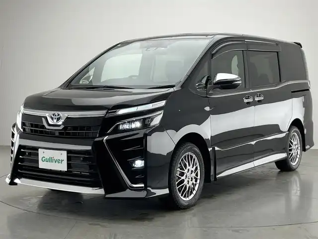 トヨタ ヴォクシー ハイブリッド ZS 煌Ⅲ 愛知県 2021(令3)年 4.4万km ブラック 社外１１型ナビ　社外後席モニター　禁煙　バックカメラ　シートヒーター　両側パワスラ　前後ドラレコ　ＥＴＣ　セーフティセンス　衝突軽減　レーンキープ　ＬＥＤオートライト　黒ハーフレザー　フルセグ　ＤＶＤ