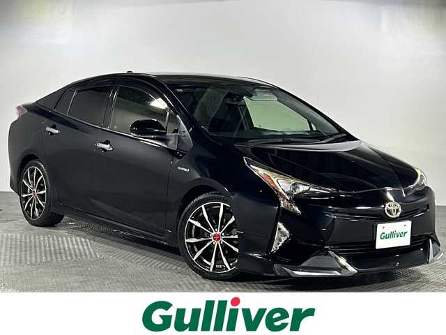 トヨタ プリウス S ツーリングセレクション 沖縄県 2016(平28)年 12.7万km アティチュードブラックマイカ 純正９インチナビ（ＢＴ，フルセグ，ラジオ，ＣＤ／ＤＶＤ）　/バックカメラ/シートヒーター　/レザーシート　/オートライト/純正フロアマット/カーテンエアバッグ/社外18インチアルミホイール　/エアロパーツ(フロント/リアアンダー)/ＬＥＤヘッドライト　/ステアリングスイッチ　/スマートキー