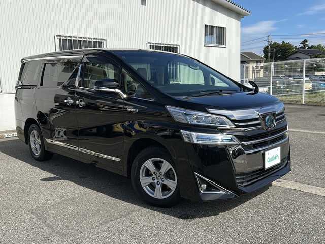 トヨタ ヴェルファイア ハイブリット X 富山県 2019(令1)年 6.7万km ブラック ワンオーナー/両側パワスラ/スマートキー×２/社外メモリーナビ(AVIC-CL902)/DVD/BT/USB/フルセグTV/ビルトインETC/ミラー型前後ドラレコ/社外フリップダウンモニター(TVM-FW1020)/LEDヘッドライト/フォグ/プッシュスタート/衝突安全ブレーキ/レーンキープアシスト/オートハイビーム/レーダークルコン/電動Pブレーキ/電格ウィンカーミラー/シートカバー/Clazzioフロアマット/電動Pブレーキ/皮巻きステアリング/ステアリングスイッチ/AC100V電源/保証書・取説・ナビ取説