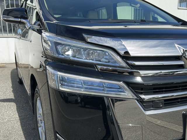 トヨタ ヴェルファイア ハイブリット X 富山県 2019(令1)年 6.7万km ブラック ワンオーナー/両側パワスラ/スマートキー×２/社外メモリーナビ(AVIC-CL902)/DVD/BT/USB/フルセグTV/ビルトインETC/ミラー型前後ドラレコ/社外フリップダウンモニター(TVM-FW1020)/LEDヘッドライト/フォグ/プッシュスタート/衝突安全ブレーキ/レーンキープアシスト/オートハイビーム/レーダークルコン/電動Pブレーキ/電格ウィンカーミラー/シートカバー/Clazzioフロアマット/電動Pブレーキ/皮巻きステアリング/ステアリングスイッチ/AC100V電源/保証書・取説・ナビ取説