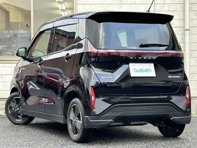 日産 サクラ X 福岡県 2022(令4)年 1.3万km ブラック ワンオーナー車/KENWOOD 9インチナビ【MDF-M910HDF】/（FM/AM/CD/DVD/Bluetooth/フルセグＴＶ）/運転支援/・車線逸脱警報/・踏み間違い衝突防止/・先行車発進お知らせ/・速度/道路標識表示/・フロント/リヤソナー/・ふらつき警報/横滑り防止/オートライト/ハイビームアシスト/純正14インチアルミホイール/コムテック前後ドライブレコーダー【ZDR035】/ビルトインＥＴＣ/e-Pedal Step/ドライブモードセレクター/純正フロアマット/純正ドアバイザー/電動パーキングブレーキ/プッシュスタート/充電ケーブル/スペアキー×1/アクセサリーソケット/ISOFIX/保証書/取扱説明書