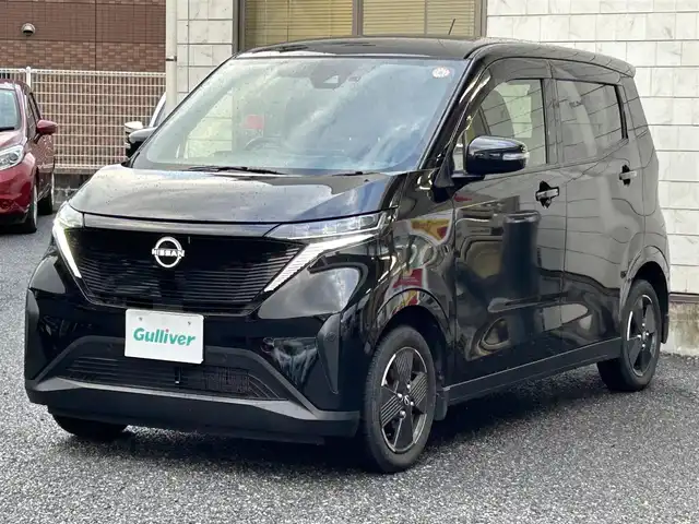 日産 サクラ X 福岡県 2022(令4)年 1.3万km ブラック ワンオーナー車/KENWOOD 9インチナビ【MDF-M910HDF】/（FM/AM/CD/DVD/Bluetooth/フルセグＴＶ）/運転支援/・車線逸脱警報/・踏み間違い衝突防止/・先行車発進お知らせ/・速度/道路標識表示/・フロント/リヤソナー/・ふらつき警報/横滑り防止/オートライト/ハイビームアシスト/純正14インチアルミホイール/コムテック前後ドライブレコーダー【ZDR035】/ビルトインＥＴＣ/e-Pedal Step/ドライブモードセレクター/純正フロアマット/純正ドアバイザー/電動パーキングブレーキ/プッシュスタート/充電ケーブル/スペアキー×1/アクセサリーソケット/ISOFIX/保証書/取扱説明書