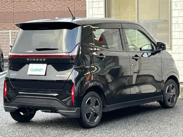 日産 サクラ X 福岡県 2022(令4)年 1.3万km ブラック ワンオーナー車/KENWOOD 9インチナビ【MDF-M910HDF】/（FM/AM/CD/DVD/Bluetooth/フルセグＴＶ）/運転支援/・車線逸脱警報/・踏み間違い衝突防止/・先行車発進お知らせ/・速度/道路標識表示/・フロント/リヤソナー/・ふらつき警報/横滑り防止/オートライト/ハイビームアシスト/純正14インチアルミホイール/コムテック前後ドライブレコーダー【ZDR035】/ビルトインＥＴＣ/e-Pedal Step/ドライブモードセレクター/純正フロアマット/純正ドアバイザー/電動パーキングブレーキ/プッシュスタート/充電ケーブル/スペアキー×1/アクセサリーソケット/ISOFIX/保証書/取扱説明書