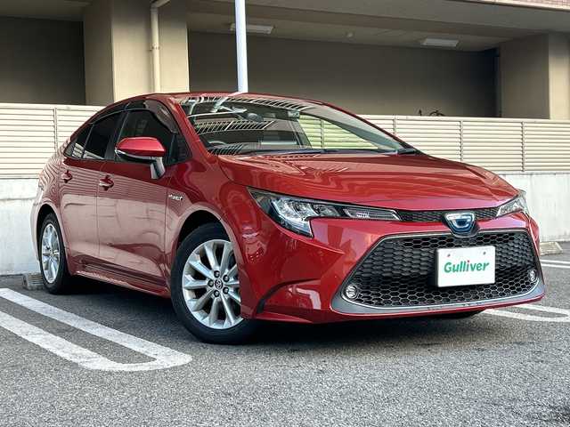 トヨタ カローラ ハイブリット S 大阪府 2020(令2)年 3万km スカーレットメタリック ワンオーナー/OP：シートヒーター/OP：9インチディスプレイオーディオ6スピーカー/　コネクティッドナビ対応/AM/FM/フルセグTV/Bluetooth/DVD/AppleCarPlay/Android Auto/OP：ステアリングヒーター/バックカメラ/Toyota Safety Sense/・プリクラッシュセーフティー/・レーントレーシングアシスト/・レーンデパーチャーアラート/・レーダークルーズコントロール/・オートマチックハイビーム/・インティジェントクリアランスソナー/ブラインドスポットモニター＋パーキングサポートブレーキ/クリアランスソナー＆バックソナー/電子パーキングブレーキ/ブレーキホールド/ステアリングヒーター/前後ドライブレコーダー　（TZ-205W）/ビルドインETC/スマートキー/純正16インチアルミホイール/保証書/取扱説明書