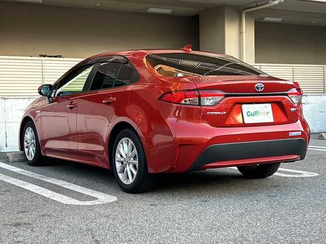 トヨタ カローラ ハイブリット S 大阪府 2020(令2)年 3万km スカーレットメタリック ワンオーナー/OP：シートヒーター/OP：9インチディスプレイオーディオ6スピーカー/　コネクティッドナビ対応/AM/FM/フルセグTV/Bluetooth/DVD/AppleCarPlay/Android Auto/OP：ステアリングヒーター/バックカメラ/Toyota Safety Sense/・プリクラッシュセーフティー/・レーントレーシングアシスト/・レーンデパーチャーアラート/・レーダークルーズコントロール/・オートマチックハイビーム/・インティジェントクリアランスソナー/ブラインドスポットモニター＋パーキングサポートブレーキ/クリアランスソナー＆バックソナー/電子パーキングブレーキ/ブレーキホールド/ステアリングヒーター/前後ドライブレコーダー　（TZ-205W）/ビルドインETC/スマートキー/純正16インチアルミホイール/保証書/取扱説明書