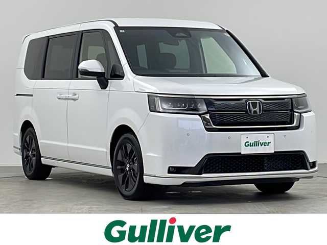 ホンダ ステップワゴン スパーダ eHEV 千葉県 2025(令7)年 0.1万km未満 プラチナホワイトパール 登録済み未使用車/ホンダセンシング/・衝突軽減ブレーキ/・ブラインドスポットインフォメーション/・先行車発進お知らせ機能/・標識認識アシスト/・路外逸脱抑制機能/・車線維持支援システム/両側パワースライドドア/パワーバックドア/11.4インチナビHonda CONNECTナビ/・型式：LXM-247VFLi/・CD/DVD/Bluetooth/USB/フルセグTV/バックカメラ/LEDオートヘッドライト/ハーフレザーシート/シートヒーター/革巻きステアリング/純正16インチアルミホイール/パドルシフト/ステアリングスイッチ/オートエアコン/プッシュスタート/スマートキー/スペアキー1本/禁煙車