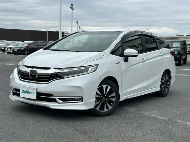 ホンダ シャトル ハイブリッド X ホンダセンシング 奈良県 2019(令1)年 5.6万km プラチナホワイトパール ホンダセンシング　/純正ナビ　/フルセグTV　/ビルドインETC　/Bluetooth　/CDチェンジャー　/DVD再生機能　/スマートキー/スペアキー/バックカメラ/パドルシフト/シートヒーター　/純正フロアマット　/純正アルミホイール　/クルーズコントロール/衝突被害軽減システム/LEDヘッドライト/オートライト　/オートマチックハイビーム