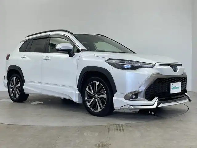 トヨタ カローラ クロス ハイブリッド Z 鹿児島県 2023(令5)年 3.8万km プラチナホワイトパールマイカ 純正9インチディスプレイオーディオ/モデリスタフルエアロ/ワイヤレス充電/プリクラッシュセーフティ/レーンキープアシスト/レーダークルーズコントロール/電動リアゲート/ブラインドスポットモニター/オートライト/ハーフレザーシート/シートヒーター/純正フロアマット/純正ドアバイザー/スマートキー/プッシュスタート