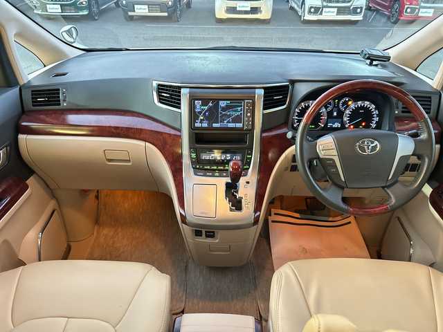 トヨタ ヴェルファイア 2．4V 愛媛県 2010(平22)年 9.6万km ホワイトパールクリスタルシャイン フリップダウンモニター/純正ナビ（NHZN-W60G）/・Bluetooth/・CD/DVD/フルセグTV/バックカメラ/ETC/両側パワースライドドア/ステアリングスイッチ/オートライト/オートマチックハイビーム/コーナセンサー/リモコンキー/スペアキー/保証書/取扱説明書