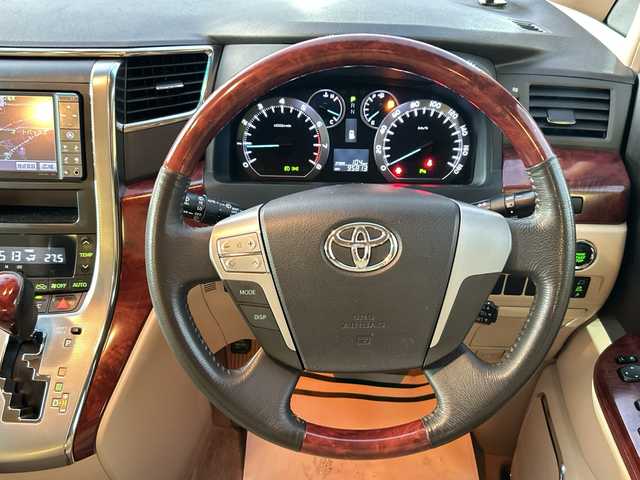 トヨタ ヴェルファイア 2．4V 愛媛県 2010(平22)年 9.6万km ホワイトパールクリスタルシャイン フリップダウンモニター/純正ナビ（NHZN-W60G）/・Bluetooth/・CD/DVD/フルセグTV/バックカメラ/ETC/両側パワースライドドア/ステアリングスイッチ/オートライト/オートマチックハイビーム/コーナセンサー/リモコンキー/スペアキー/保証書/取扱説明書