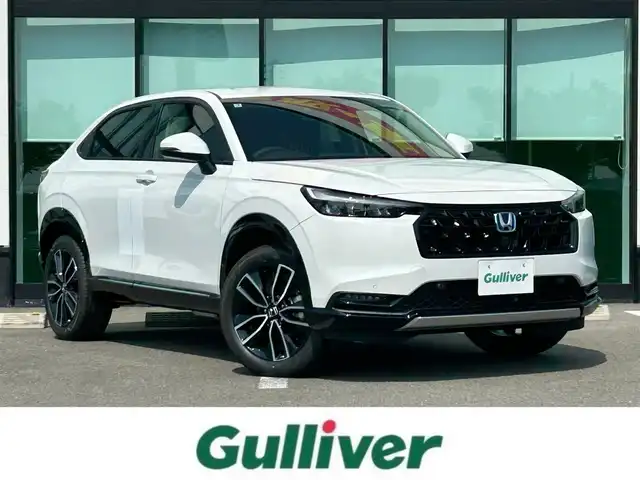 ホンダ ヴェゼル ハイブリッド e:HEV Z 和歌山県 2025(令7)年 0.1千km プラチナホワイトパール 純正Honda CONNECTディスプレーオーディオ（ナビ付）/フルセグTV/Bluetooth/USB/カープレイ/バックカメラ/ETC2.0/ワイヤレス充電器/ホンダセンシング/衝突軽減カメラ/路外逸脱抑制/BSM/踏み間違い防止機能/クリアランスソナー/レーダークルーズコントロール/革巻きステアリング/パドルシフト/ステアリングヒーター/ステアリングスイッチ/ハーフレザーシート/前席シートヒーター/LEDヘッドライト/オートライト/純正18インチAW/フロントグリル　ベルリナブラック/プッシュスタート/スマートキー/スペアキー/取扱説明書/保証書