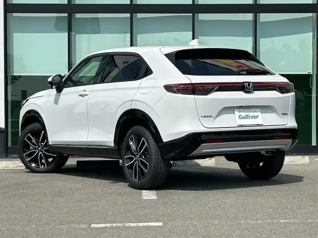 ホンダ ヴェゼル ハイブリッド e:HEV Z 和歌山県 2025(令7)年 0.1千km プラチナホワイトパール 純正Honda CONNECTディスプレーオーディオ（ナビ付）/フルセグTV/Bluetooth/USB/カープレイ/バックカメラ/ETC2.0/ワイヤレス充電器/ホンダセンシング/衝突軽減カメラ/路外逸脱抑制/BSM/踏み間違い防止機能/クリアランスソナー/レーダークルーズコントロール/革巻きステアリング/パドルシフト/ステアリングヒーター/ステアリングスイッチ/ハーフレザーシート/前席シートヒーター/LEDヘッドライト/オートライト/純正18インチAW/フロントグリル　ベルリナブラック/プッシュスタート/スマートキー/スペアキー/取扱説明書/保証書