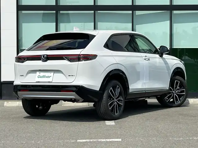 ホンダ ヴェゼル ハイブリッド e:HEV Z 和歌山県 2025(令7)年 0.1千km プラチナホワイトパール 純正Honda CONNECTディスプレーオーディオ（ナビ付）/フルセグTV/Bluetooth/USB/カープレイ/バックカメラ/ETC2.0/ワイヤレス充電器/ホンダセンシング/衝突軽減カメラ/路外逸脱抑制/BSM/踏み間違い防止機能/クリアランスソナー/レーダークルーズコントロール/革巻きステアリング/パドルシフト/ステアリングヒーター/ステアリングスイッチ/ハーフレザーシート/前席シートヒーター/LEDヘッドライト/オートライト/純正18インチAW/フロントグリル　ベルリナブラック/プッシュスタート/スマートキー/スペアキー/取扱説明書/保証書