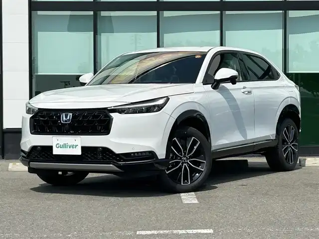 ホンダ ヴェゼル ハイブリッド e:HEV Z 和歌山県 2025(令7)年 0.1千km プラチナホワイトパール 純正Honda CONNECTディスプレーオーディオ（ナビ付）/フルセグTV/Bluetooth/USB/カープレイ/バックカメラ/ETC2.0/ワイヤレス充電器/ホンダセンシング/衝突軽減カメラ/路外逸脱抑制/BSM/踏み間違い防止機能/クリアランスソナー/レーダークルーズコントロール/革巻きステアリング/パドルシフト/ステアリングヒーター/ステアリングスイッチ/ハーフレザーシート/前席シートヒーター/LEDヘッドライト/オートライト/純正18インチAW/フロントグリル　ベルリナブラック/プッシュスタート/スマートキー/スペアキー/取扱説明書/保証書