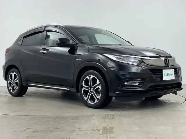ホンダ ヴェゼル ハイブリッド Z ホンダセンシング 鹿児島県 2019(平31)年 3.1万km クリスタルブラックパール 純正ナビ/・CD/DVD/・FM/AM/・フルセグTV/・SD/Music Rack/・USB/HDMI/・Bluetooth/ホンダセンシング/●衝突軽減ブレーキ〈CMBS〉/●誤発進抑制機能/●歩行者事故低減ステアリング/●路外逸脱抑制機能/●ACC〈アダプティブ・クルーズ・コントロール〉/●LKAS〈車線維持支援システム〉/●先行車発進お知らせ機能/●標識認識機能/バックカメラ/サイドカーテンエアバッグ/LEDヘッドライト/ハーフレザーシート/運転席+助手席シートヒーター/ドライブレコーダー/ビルトインETC/アイドリングストップ/パドルシフト/横滑り防止装置