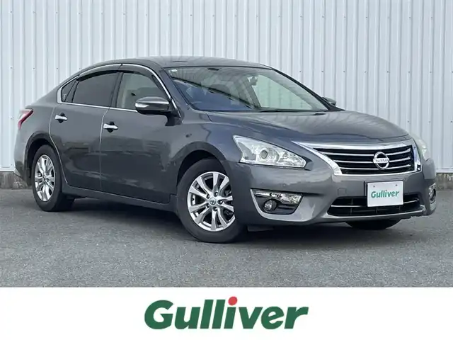 日産 ティアナ XL ナビAVMパッケージ 福岡県 2017(平29)年 7.4万km ダークメタルグレー メーカー純正ナビ/フルセグTV/CD/DVD/BT/AUX/アラウンドビューモニター/エマージェンシーブレーキ/ＢＳＷ/D/Nパワーシート/N席オットマン/ＬＤＷ/クリアランスソナー/ＨＩＤオートライト/フォグランプ/革巻きステアリング/純正ＡＷ/クルーズコントロール/ステアリングリモコン/ビルトインＥＴＣ/スマートキー/プッシュスタート/トランクスルー