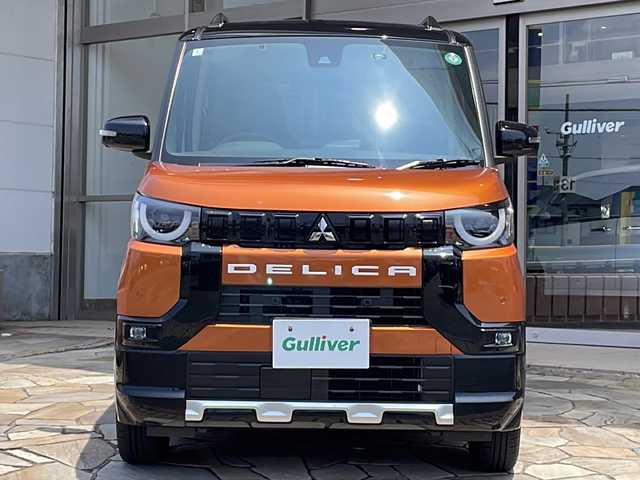 三菱 デリカミニ T プレミアム 静岡県 2024(令6)年 0.9万km オレンジⅡ 【主要装備】/デジタルインナーミラー　/アラウンドビューモニター　/純正ナビ　/マイパイロット　/両側パワースライドドア　/シートヒーター　/ステアリングヒーター　/アイドリングストップ　/ドライブレコーダー　/ＥＴＣ　/パドルシフト/純正15インチアルミホイール/プッシュスタート/スマートキー/スペアキー有り/LEDヘッドライト/取説・保証書付き