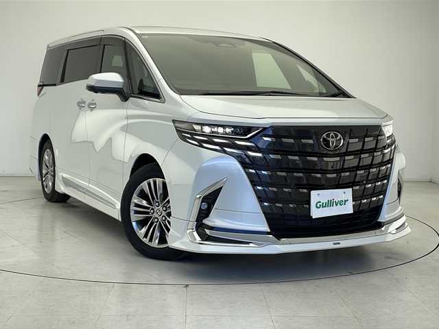 トヨタ アルファードハイブリット Z 千葉県 2023(令5)年 2.3万km プラチナホワイトパールマイカ モデリスタエアロ/純正メモリナビ/フルセグテレビ/純正フリップダウンモニター/Miracast/HDMI/ワイヤレス充電/パノラミックビューモニター/ブラインドスポットモニター/バックカメラ/アイドリングストップ/オットマン/キャプテンシート/クルーズコントロール/電動サンシェード/電動ルーフシェード/プッシュスタート/レザーコンビハンドル/電動ハンドルチルト/運転席シートメモリ/ステアリングヒーター/両側パワースライドドア/パワーバックドア/ETC2.0