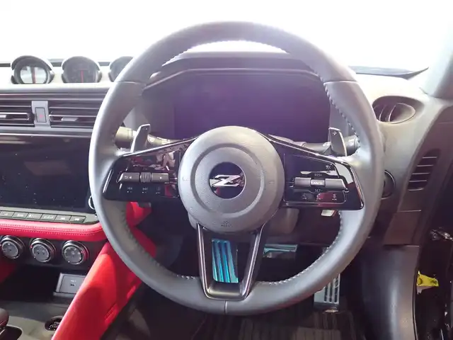 日産 フェアレディ Ｚ バージョンST 千葉県 2024(令6)年 0.1万km 黒 ワンオーナー/純正ナビゲーション/・Bluetooth/AM/FM/バックカメラ/ビルトインETC/3連サブメーター/・電圧計/ターボ回転計/ブースト計/走行支援機能/・インテリジェントクルーズコントロール/・インテリジェントエマージェンシーブレーキ/・踏み間違い衝突防止アシスト/・インテリジェントFCW（前方衝突予測警報）/・BSW（後側方車両検知警報）/・LDW（車線逸脱警報）/・インテリジェントDA（ふらつき警報）/・RCTA（後退時車両検知警報）/赤黒ハーフレザーシート/シートヒーター/プッシュスタート/インテリジェントキー2本/ステアリングスイッチ/パドルシフト/オートライト/LEDヘッドライト/純正19インチAW/純正フロアマット/ウィンカーミラー/電動格納ミラー/取扱説明書/保証書