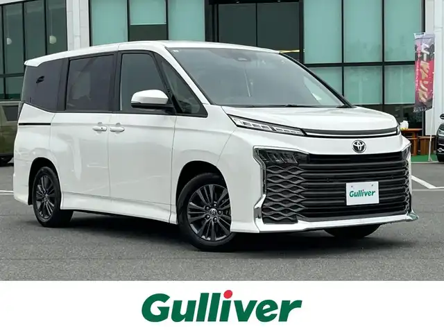 トヨタ ヴォクシー S－G 奈良県 2023(令5)年 1.5万km ホワイトパールクリスタルシャイン トヨタセーフティセンス　/純正ディスプレイオーディオ　/Bluetooth/ビルドインETC/ＵＳＢ入力端子/バックカメラ　/両側パワースライドドア　/電動パーキングブレーキ　/オートマチックブレーキホールド/コーナーセンサー　/クルーズコントロール　/ＬＥＤヘッドライト　/純正フロアマット/純正アルミホイール/オートライト/盗難防止装置