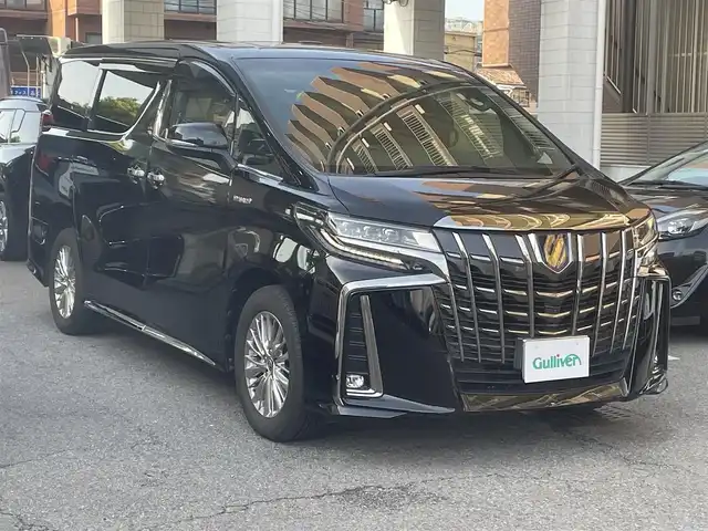 トヨタ アルファードハイブリット S タイプゴールド 大阪府 2021(令3)年 6.6万km ブラック メーカーOP10.5インチSDナビ/TV/DISC/Bluetooth//パノラミックビューモニター/JBLプレミアムサウンドシステム/13.3インチリアシートエンターテイメントシステム/ツインムーンルーフ/デジタルインナーミラー/トヨタセーフティセンス/ブラインドスポットモニター/リアクロストラフィックオートブレーキ/インテリジェントクリアランスソナー/インテリジェントパーキングアシスト2/アダプティブハイビーム/レーダークルーズコントロール/プリクラッシュセーフティー/ロードサインアシスト/シーケンシャルLEDヘッドライト/ETC2.0/スマートキー×2