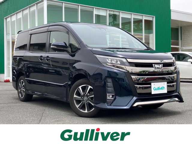 トヨタ ノア Si 静岡県 2018(平30)年 2.5万km ブラッキッシュアゲハガラスフレーク エンジンスタートストップ/福祉車両/スロープ/パワーステアリング/パワーウィンドウ/アイドリングストップ/スマートキー/Wオートエアコン/クルーズコントロール/フリップダウンモニター/ETC/USB入力端子/バックカメラ/純正SDナビ（CD.BT.フルセグ）/3列シート/ドライブレコーダー/ウォークスルー/純正フロアマット/純正アルミホイール/両側パワースライドドア/ABS/横滑り防止装置/コーナーセンサー前後/レーンキープアシスト/オートライト/オートマチックハイビーム/Wエアバック/衝突軽減システム