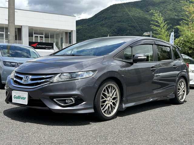 ホンダ ジェイド ハイブリッド 長崎県 2016(平28)年 8.5万km モダンスティールM 純正HDDナビ(BT/CD/DVD/FM/AM/フルセグ)/プッシュスタート/スマートキー/スペアキー(1本)/後席エアコン(温度調節機能無し)/追従機能無しクルーズコントロール/バックカメラ/純正フロアマット/AMD18インチアルミホイール/ABS/ビークルスタビリティアシスト/車両接近通報装置/オートライト/SRSダブル・サイドエアバッグ/SRSカーテンエアバッグ/ISOFIX/ECON/無限デュアルサイレンサー/無限シフトノブ(純正品あり)/HONDA純正テールゲートスポイラー