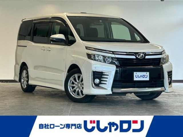 トヨタ ヴォクシー ZS 静岡県 2014(平26)年 13.4万km ホワイトパールクリスタルシャイン (株)IDOMが運営する【じしゃロン浜松店】の自社ローン専用車両になりますこちらは現金またはオートローンご利用時の価格です。自社ローンご希望の方は別途その旨お申付け下さい/純正メモリーナビ（NSZT-W62G）/CD/DVD/AM/FM/Bluetooth/サンルーフ/バックカメラ/フォグランプ/社外16inAW/フロアマット