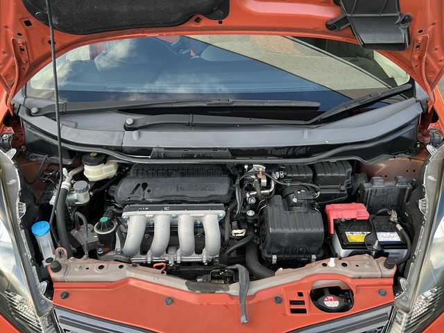 ホンダ フィット RS 愛知県 2012(平24)年 3.7万km サンセットオレンジⅡ 登録時走行距離36172キロ/純正ナビゲーション/６速マニュアルシフト/純正フロアマット/ワンセグＴＶ/横滑り装置/純正アルミホイール/助手席エアバック/オートライト