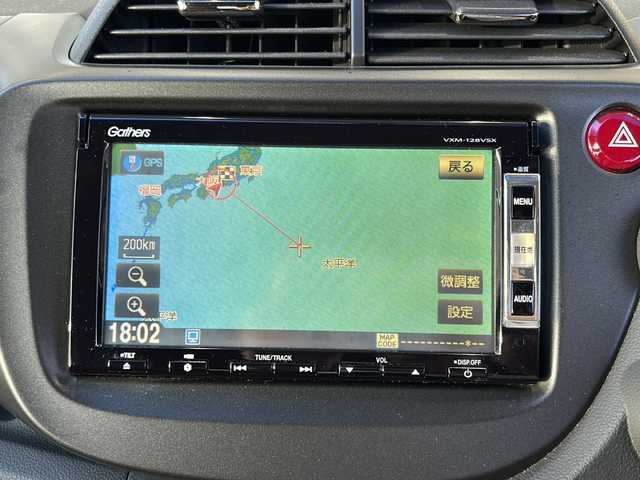 ホンダ フィット RS 愛知県 2012(平24)年 3.7万km サンセットオレンジⅡ 登録時走行距離36172キロ/純正ナビゲーション/６速マニュアルシフト/純正フロアマット/ワンセグＴＶ/横滑り装置/純正アルミホイール/助手席エアバック/オートライト