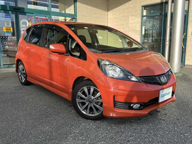 ホンダ フィット RS 愛知県 2012(平24)年 3.7万km サンセットオレンジⅡ 登録時走行距離36172キロ/純正ナビゲーション/６速マニュアルシフト/純正フロアマット/ワンセグＴＶ/横滑り装置/純正アルミホイール/助手席エアバック/オートライト