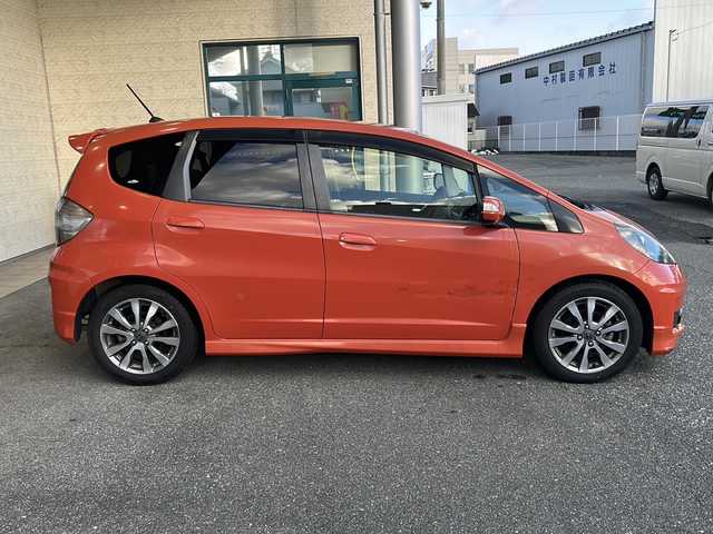 ホンダ フィット RS 愛知県 2012(平24)年 3.7万km サンセットオレンジⅡ 登録時走行距離36172キロ/純正ナビゲーション/６速マニュアルシフト/純正フロアマット/ワンセグＴＶ/横滑り装置/純正アルミホイール/助手席エアバック/オートライト