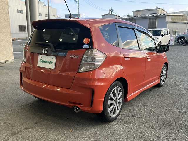 ホンダ フィット RS 愛知県 2012(平24)年 3.7万km サンセットオレンジⅡ 登録時走行距離36172キロ/純正ナビゲーション/６速マニュアルシフト/純正フロアマット/ワンセグＴＶ/横滑り装置/純正アルミホイール/助手席エアバック/オートライト