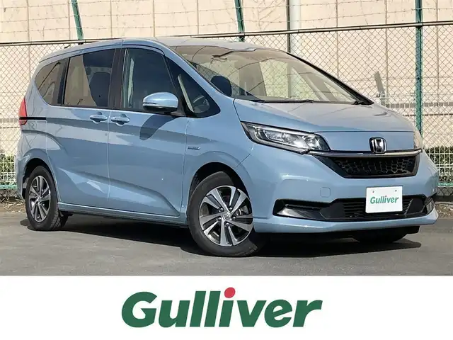 ホンダ フリード ハイブリット G ホンダセンシング 東京都 2020(令2)年 3.2万km シーグラスブルーパール 純正９型メモリナビ＆フルセグ　/・BluetoothAudio/USB/・CD/SD/DVD/AM/FM/両側パワースライドドア　/ＬＥＤヘッドライト　/ホンダセンシング　/・アダプティブクルーズコントロール　/・歩行者事故低減ステアリング　/・標識認識機能/・衝突軽減ブレーキ/・路外逸脱抑制機能/・先行車発進お知らせ機能/キャプテンシート/プッシュエンジンスタート/Wエアバック＆ABS/保証書＆取説/ビルトインＥＴＣ　