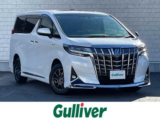 トヨタ アルファードハイブリット X 群馬県 2021(令3)年 5.1万km ホワイトパールクリスタルシャイン トヨタセーフティーセンス/・衝突軽減ブレーキ/・クルーズコントロール/・クリアランスソナー/・オートライト/・オートハイビーム/・レーンキープアシスト/・SOSコール/・横滑り防止/9インチ純正ディスプレイオーディオ/・AM/FM/フルセグTV/・Bluetooth/USB/両側電動スライドドア/バックカメラ/サンルーフ/フリップダウンモニター/LEDヘッドライト/LEDフォグランプ/オートホールド/電動パーキング/ドライブレコーダー/純正ドアバイザー/社外フロアマット/ETC/スマートキー/プッシュスタート