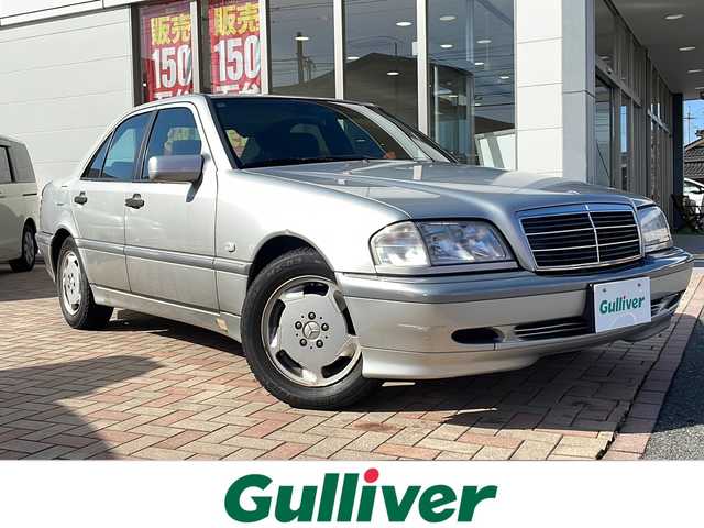 メルセデス・ベンツ Ｃ２００ 鳥取県 1998(平10)年 7.4万km ブリリアントシルバー ディーラー車/純正キーレスx2個/サンルーフ/クルーズコントロール/本木目インテリアパネル/純正カセットデッキ/純正CDチェンジャー/D席パワーシート/サイドエアバック/取説/R5/R3/H27/H21/H19記録簿