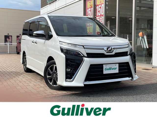 トヨタ ヴォクシー ZS 煌Ⅱ 鳥取県 2019(令1)年 5.6万km ホワイトパールクリスタルシャイン ワンオーナー/スマートキーx２個/両側パワースライド/純正８インチワイドナビ/フリップダウンモニター/バックカメラ/フルセグ・Bluetooth/プリクラッシュセーフティ/レーンデパーチャーアラート/インテリジェントソナー/オートハイビーム/ドライブレコーダー/LEDヘッドライト/LEDフォグライト/オートリトラクトミラー/リアサンシェード/ETCユニット/保証書・取説