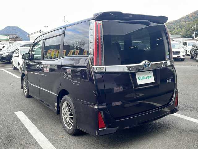 トヨタ ノア ハイブリッド Si 京都府 2018(平30)年 6.6万km ボルドーマイカメタリック 純正９インチナビ　Ｂｌｕｅｔｏｏｔｈオーディオ　フルセグ　ＤＶＤ再生　バックカメラ　後席フリップダウンモニター　プリクラッシュ　クルーズコントロール　ＬＥＤヘッドライト　ビルトインＥＴＣ　前後ドラレコ