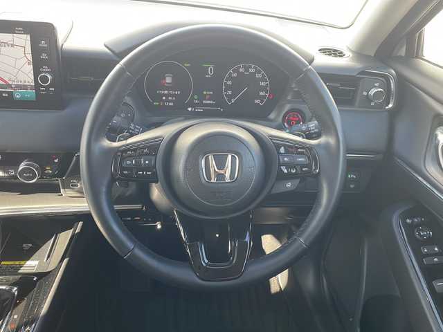 ホンダ ヴェゼル ハイブリッド e:HEV Z 三重県 2024(令6)年 3.2万km プレミアムサンライトホワイトパール 純正ナビ/ＡｐｐｌｅＣａｒＰｌａｙ/ＡｎｄｒｏｉｄｏAuto/BSM/ビルトインETC2.0/ワイヤレス充電/スペアキー/シートヒーター/ステアリングヒーター/パドルシフト/ステアリングスイッチ/ハーフレザーシート/電動リアゲート/追従クルーズコントロール/レーンキープアシスト/SOSコール/衝突被害軽減システム/踏み間違い防止/先行車発進お知らせ/標識認識システム/LEDオートライト/禁煙車