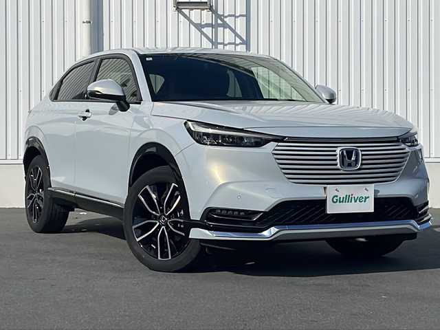 ホンダ ヴェゼル ハイブリッド e:HEV Z 三重県 2024(令6)年 3.2万km プレミアムサンライトホワイトパール 純正ナビ/ＡｐｐｌｅＣａｒＰｌａｙ/ＡｎｄｒｏｉｄｏAuto/BSM/ビルトインETC2.0/ワイヤレス充電/スペアキー/シートヒーター/ステアリングヒーター/パドルシフト/ステアリングスイッチ/ハーフレザーシート/電動リアゲート/追従クルーズコントロール/レーンキープアシスト/SOSコール/衝突被害軽減システム/踏み間違い防止/先行車発進お知らせ/標識認識システム/LEDオートライト/禁煙車
