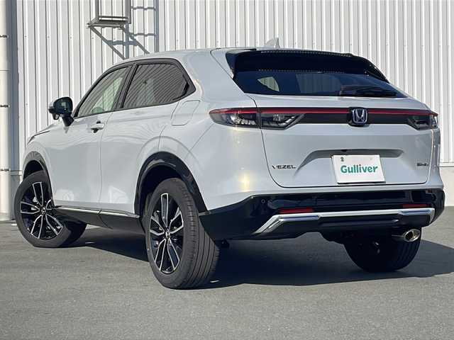 ホンダ ヴェゼル ハイブリッド e:HEV Z 三重県 2024(令6)年 3.2万km プレミアムサンライトホワイトパール 純正ナビ/ＡｐｐｌｅＣａｒＰｌａｙ/ＡｎｄｒｏｉｄｏAuto/BSM/ビルトインETC2.0/ワイヤレス充電/スペアキー/シートヒーター/ステアリングヒーター/パドルシフト/ステアリングスイッチ/ハーフレザーシート/電動リアゲート/追従クルーズコントロール/レーンキープアシスト/SOSコール/衝突被害軽減システム/踏み間違い防止/先行車発進お知らせ/標識認識システム/LEDオートライト/禁煙車