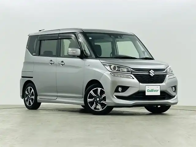 スズキ ソリオ バンディット HV MV 福島県 2019(令1)年 2.5万km プレミアムシルバーメタリック スズキセーフティサポート/・衝突軽減ブレーキ/・車線逸脱警報装置/純正8インチ大画面ナビ/・型番：CN-RZ843/・フルセグTV/Bluetooth/CD/DVD/・全方位カメラ/・ETC/・ドライブレコーダー/アイドリングストップ/左側パワースライドドア/レーダークルーズコントロール/コーナーセンサー/革巻きステアリング/・ステアリングリモコン/シートヒーター(運転席)/プッシュスタート/・スマートキー/LEDヘッドライト/・オートライト/純正フロアマット/ドアバイザー/電動格納ミラー